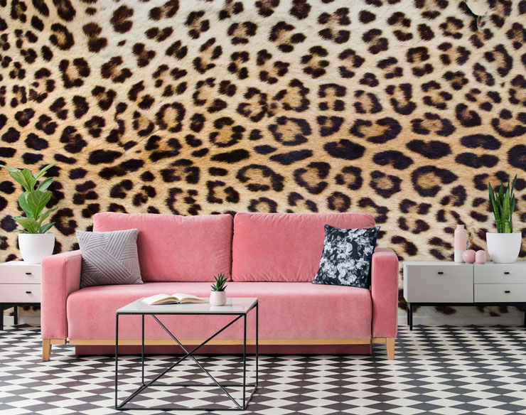 pink sofa, black and white floor and jaguar print wall mural