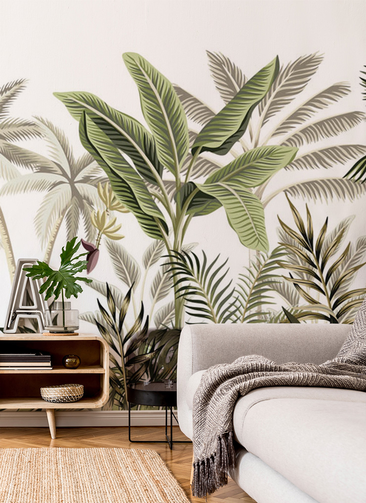green palm leaf wallpaper in timeless interiors lounge with wooden sideboard and grey sofa