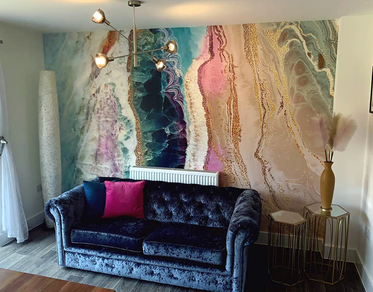colourful geode wallpaper in navy and pink lounge