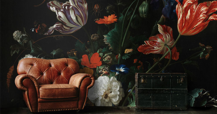 vintage dark flora painting wallpaper with brown leather chair