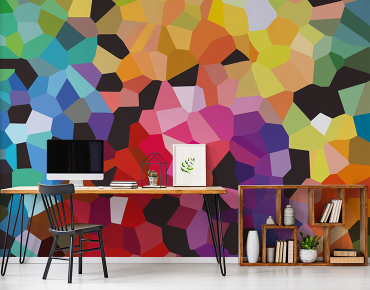 multicoloured geometric pattern wallpaper in home office