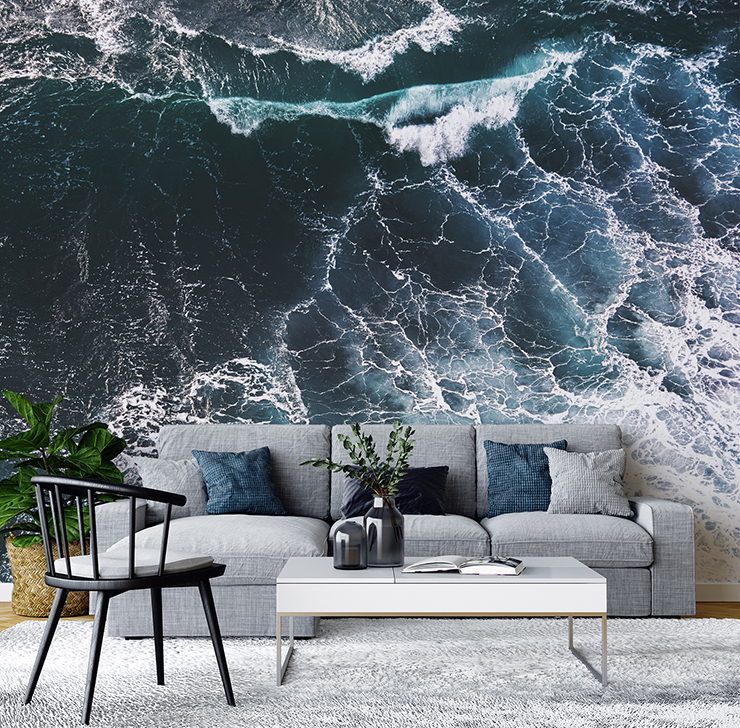 birds eye view of the oceans waves wall mural in blue and grey modern lounge