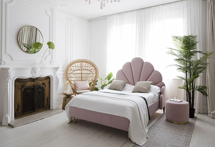 pink pastel scalloped headboard bed in on-trend master bedroom