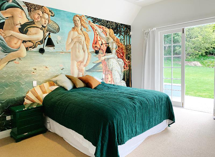 Botticelli painting of venus wallpaper in green and orange bedroom