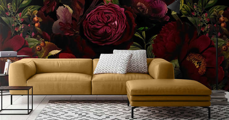 maroon dark floral illustrated wallpaper in lounge with leather mustard-yellow sofa