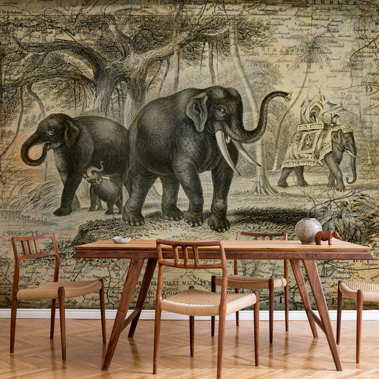 vintage black and off-white illustration of elephants in dining room with wood and wicker dining setin the jungle wallpaper 