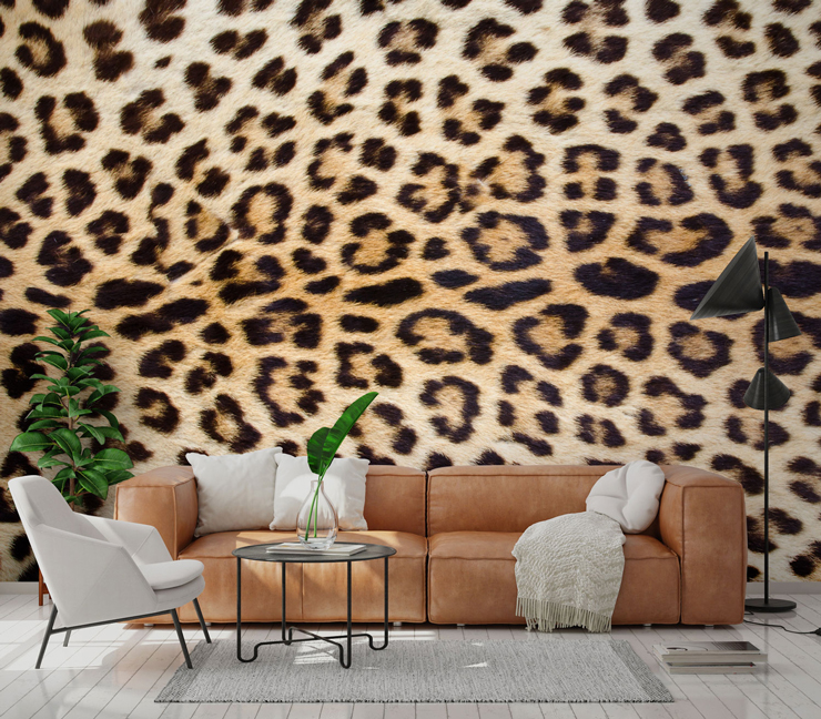 photo of jaguar's spotty coat wallpaper in lounge with brown tan leather sofa