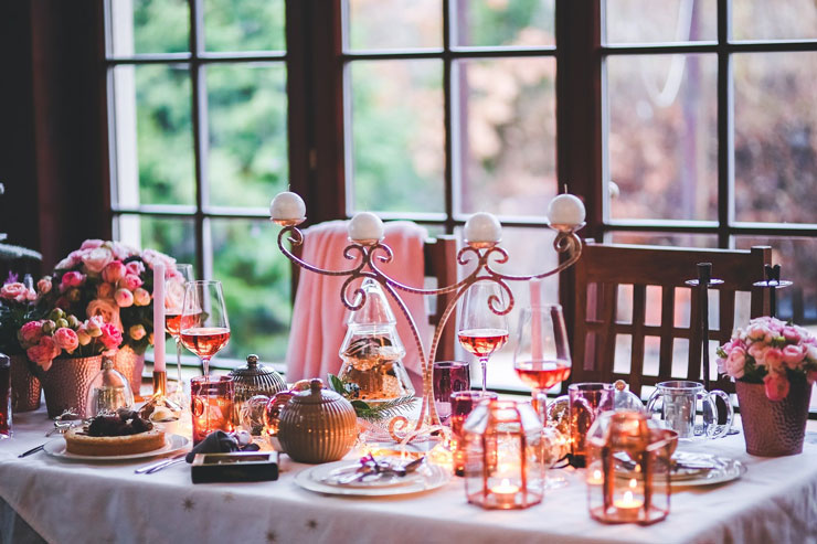 rose gold cutlery and candelabra with pink table decorations
