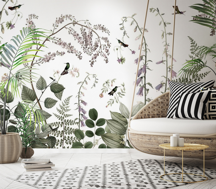 boho lounge with floral hummingbird wallpaper and wicker swinging chair and black and white patterned rug