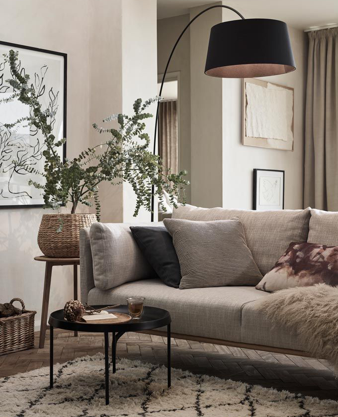 grey and black living room with black arched lamp