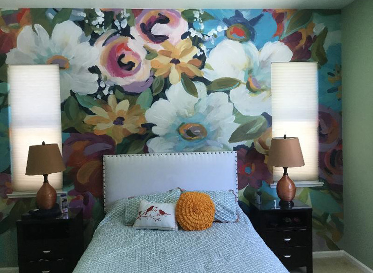 colourful flower painting wallpaper in cute bedroom with green and yellow accessories