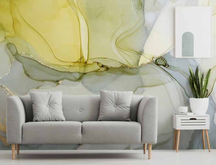 grey, white and yellow watercolour wallpaper in a lounge with a grey couch