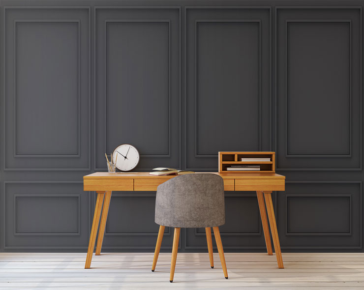 black wood panel wallpaper in trendy office with wooden desk and chair
