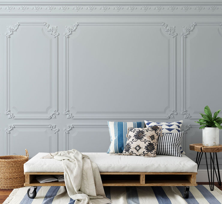 ornate white panel wallpaper in room with white and blue decor