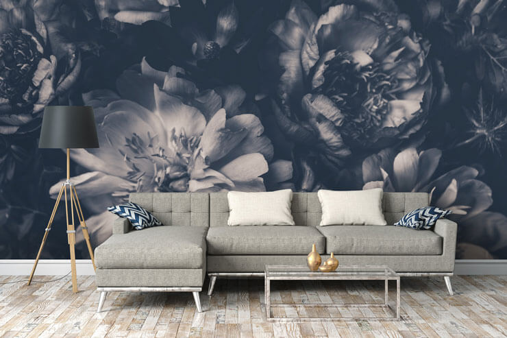 black and white floral wallpaper in trendy and cosy lounge with grey sofa