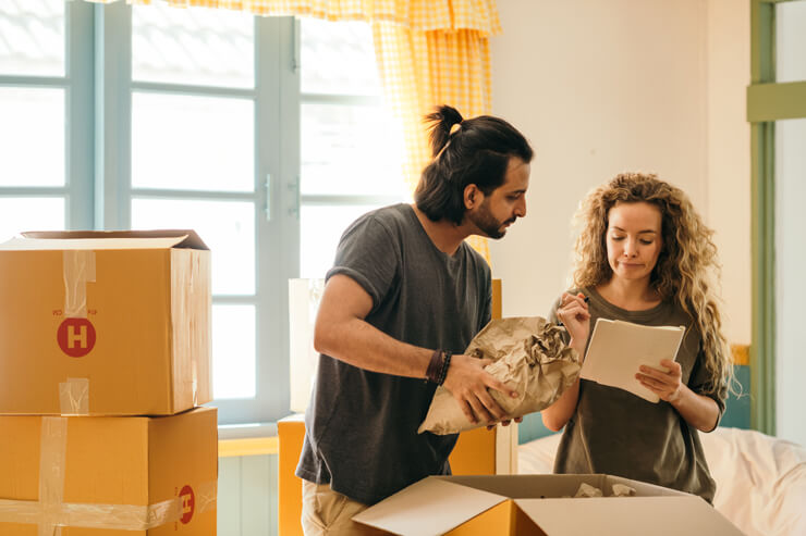 man and woman packing away their belongings