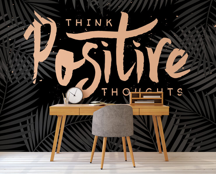 quotes wallpaper with pink writing and black background in home office with mid century style wooden desk and chair