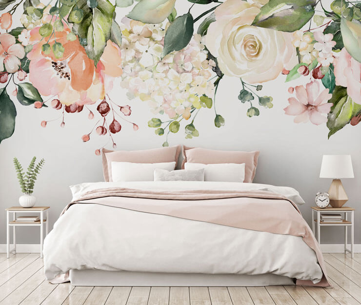 blush, off-white and green flowers handing from ceiling wallpaper in bedroom with gold, white and pink accessories