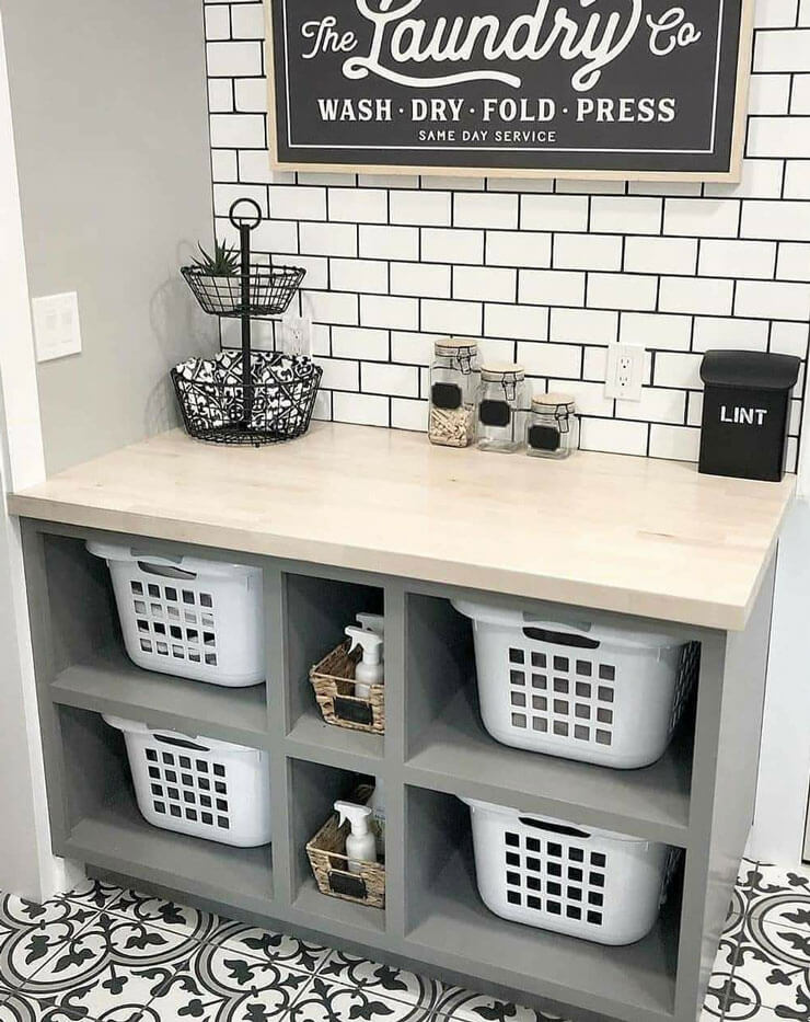 white baskets in grey and black laundry room