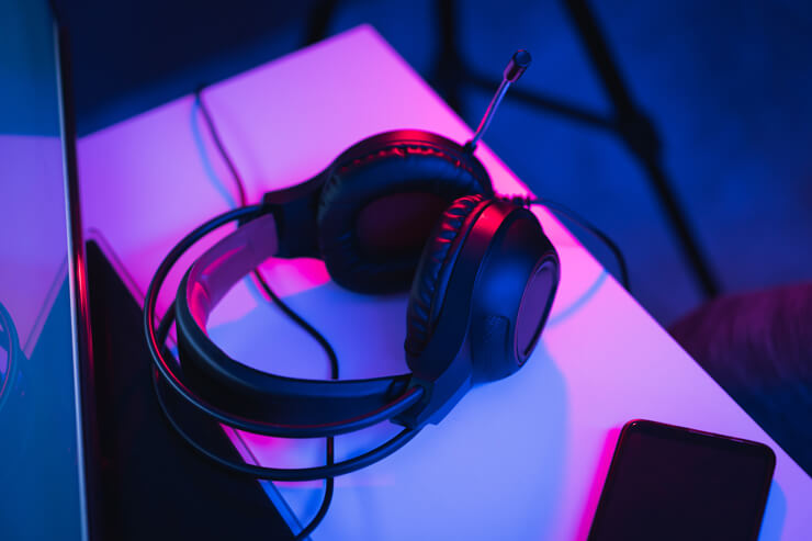 Gamer headphones in LED lit gamer room