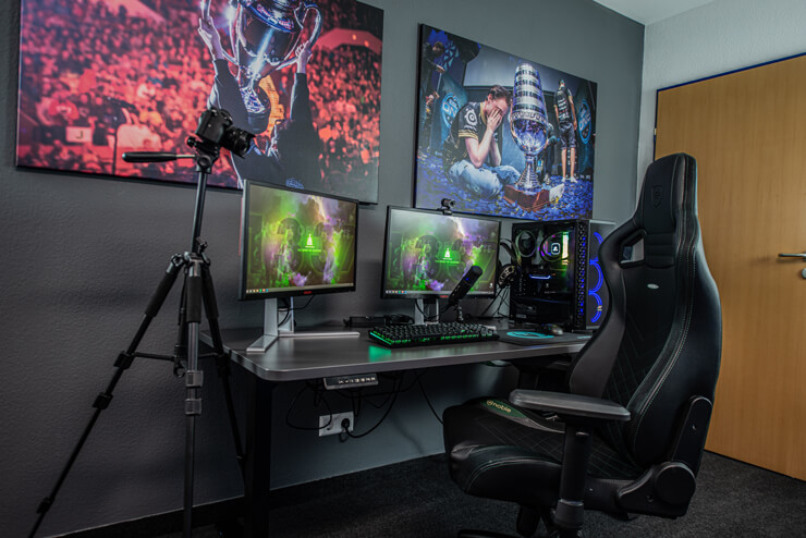 cool gamer room with two monitors and black leather gamer chair