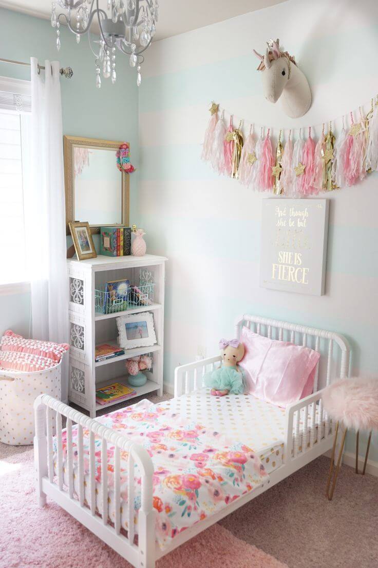 toddler room with white walls and white and pink accessories
