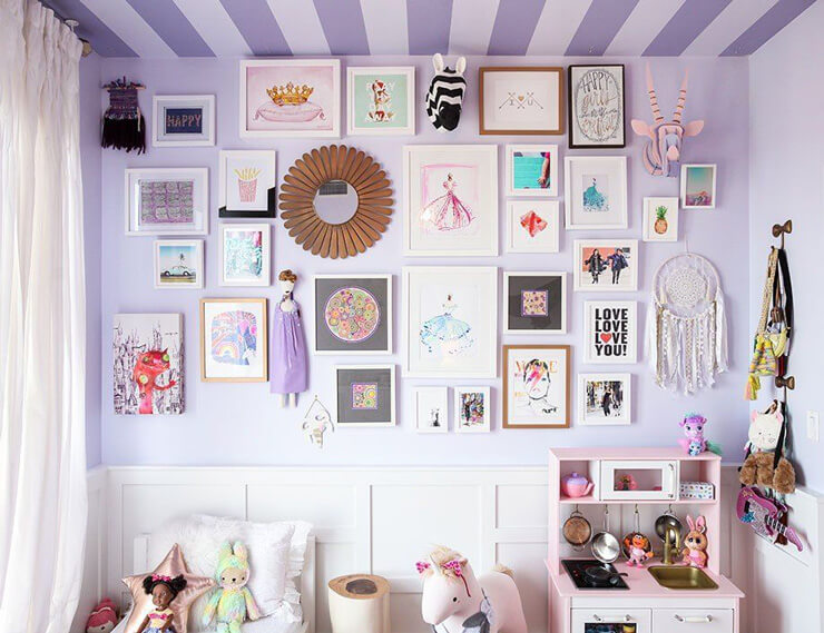 purple bedroom wall with white frames fun, girly prints