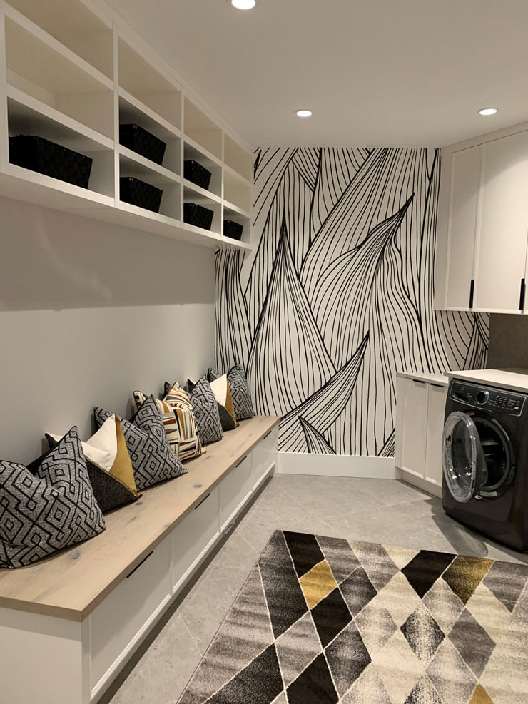 black and white leaf illustration wallpaper in gold, grey and black laundry mudroom