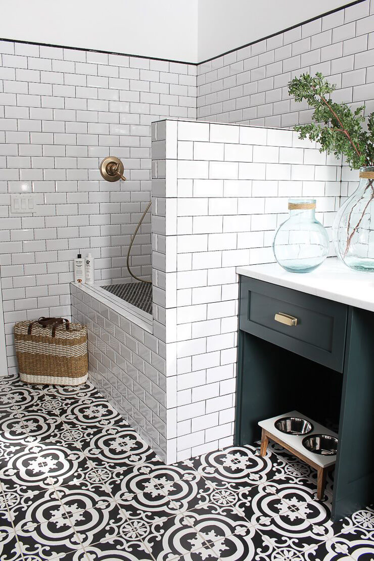 white tiled modern mudroom with dog shower