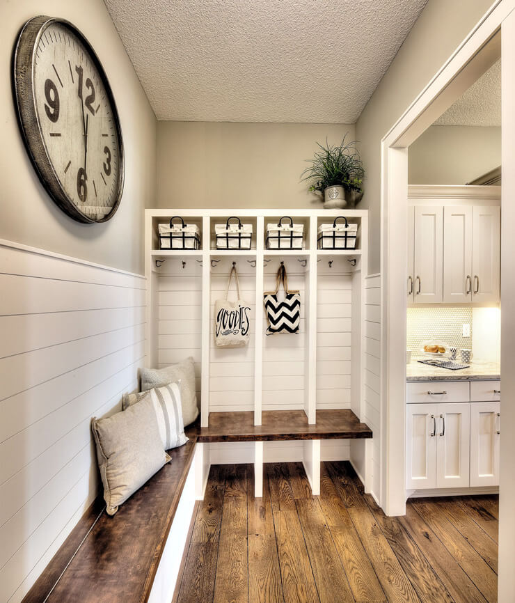 white, neutral farmhouse mudroom next to kitchen