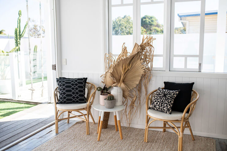 bamboo chairs in white summer house interior design setting