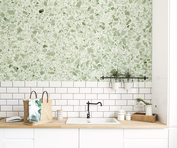 terrazzo green wallpaper above white tiles in kitchen