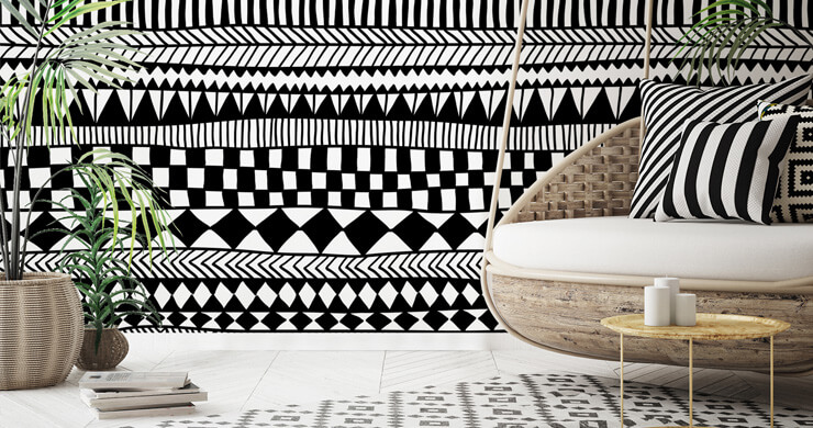 black and white tribal wallpaper in boho room