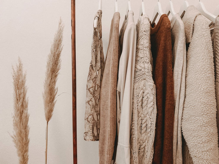 home organization natural colored clothes on a clothes rack