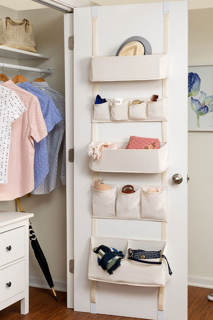 hanging door storage in white cupboard to declutter bedroom