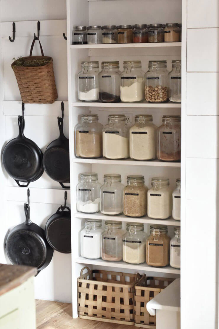 clear jars in kitchen on shelves