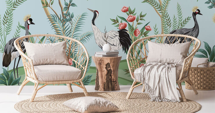chinoiserie wallpaper with cranes and blue background with wicker chairs