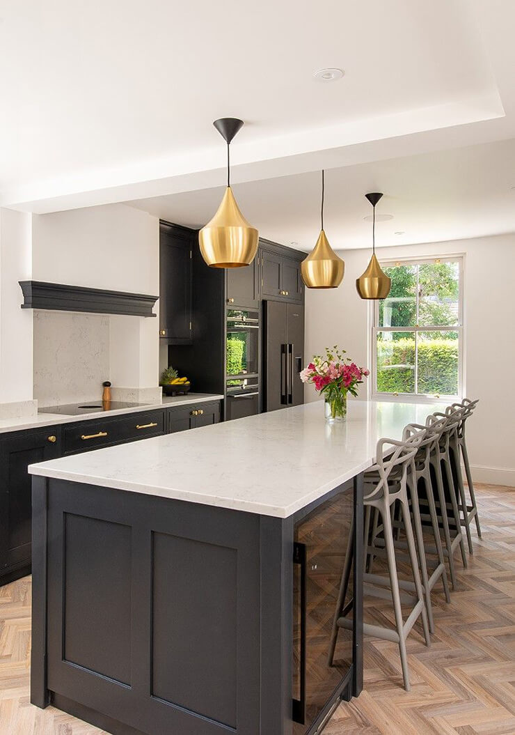 dark kitchen island in white and black room