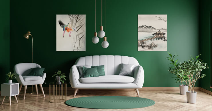 interior design trends 2022 green painted walls and green accessories with grey couch