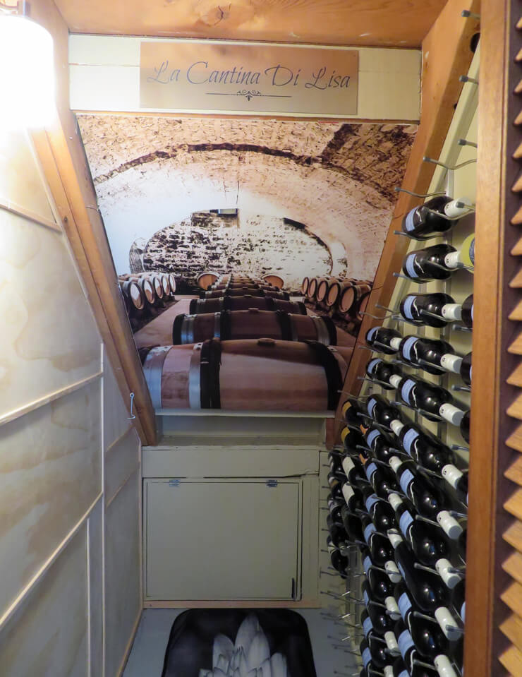 wine barrel wallpaper in under the stairs wine cellar