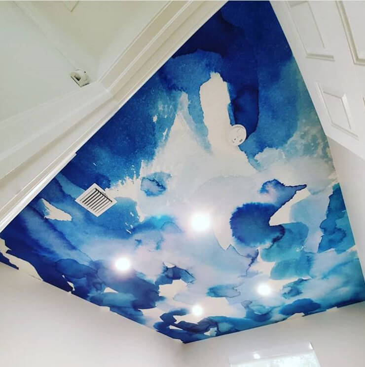 blue and white watercolour wallpaper on ceiling