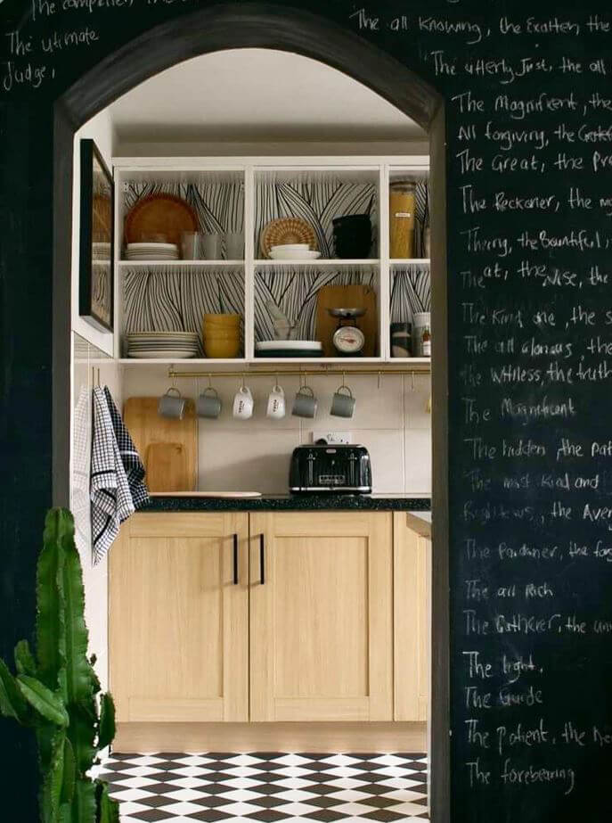 black and white leaf drawings backed behind shelves