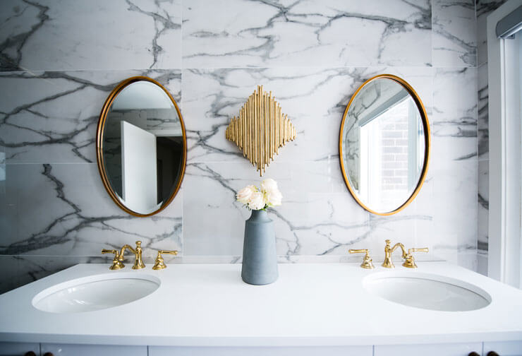 grey and white tiles and matching sinks