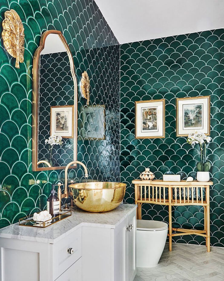 dark green mermaid tiled bathroom with gold sink