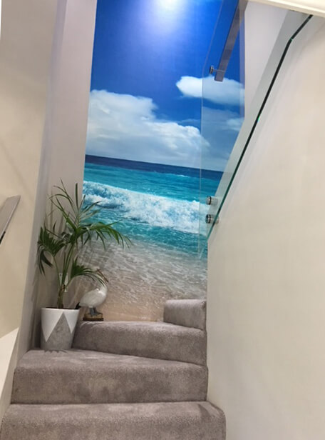 beach wall mural on attic stairs