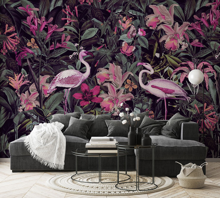 dark pink floral and flamingo wallpaper in lounge with dark grey couch