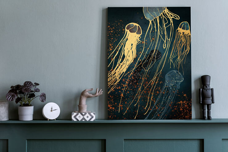 dark navy and gold toned jellyfish metal print on mantelpiece