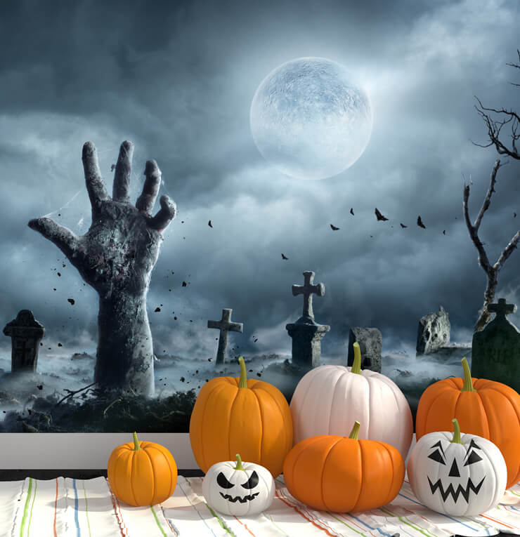 grey zombie hands in graveyard wallpaper in pumpkin decorated room