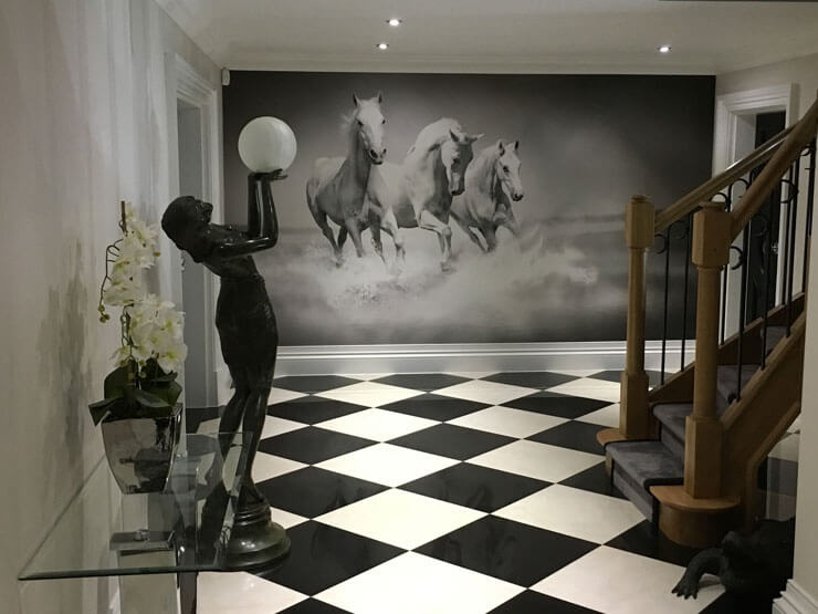 black and white tiled floor with monochrome horse wall mural in grand entry