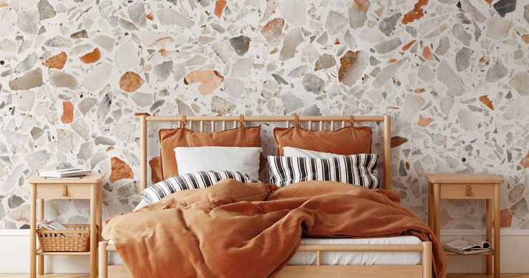 burnt orange and grey terrazzo wallpaper in bedroom